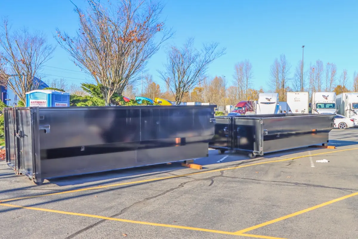 Professional dumpster rental service with roll-off container on residential driveway in Cedar Hill